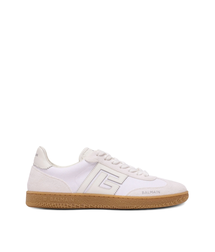 White sneaker with brown sole on a white background