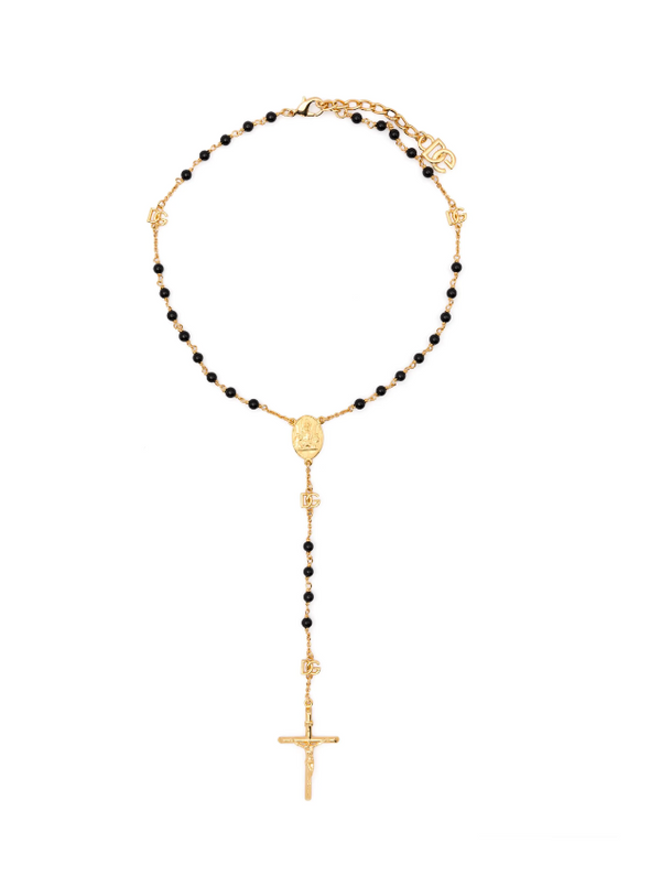 Gold and black beaded necklace with a cross pendant on a white background