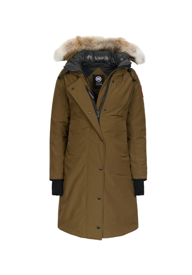 Green parka coat with fur hood on a light green background