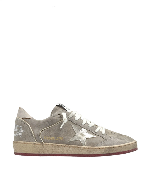 Gray sneaker with white laces on a white background