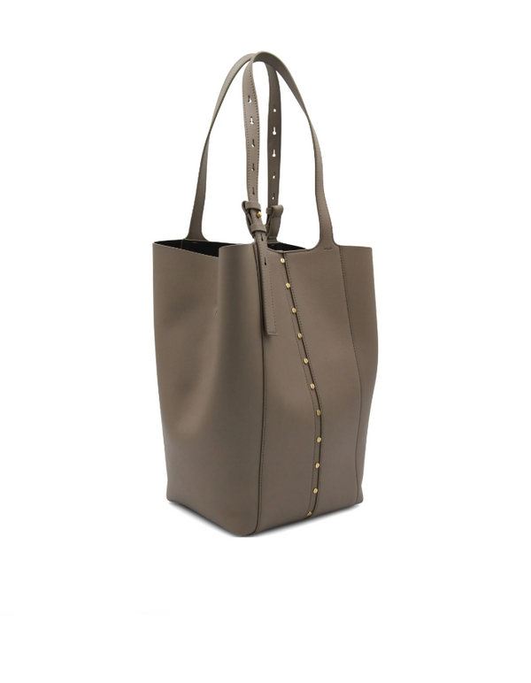 Brown tote bag with studded details on a white background
