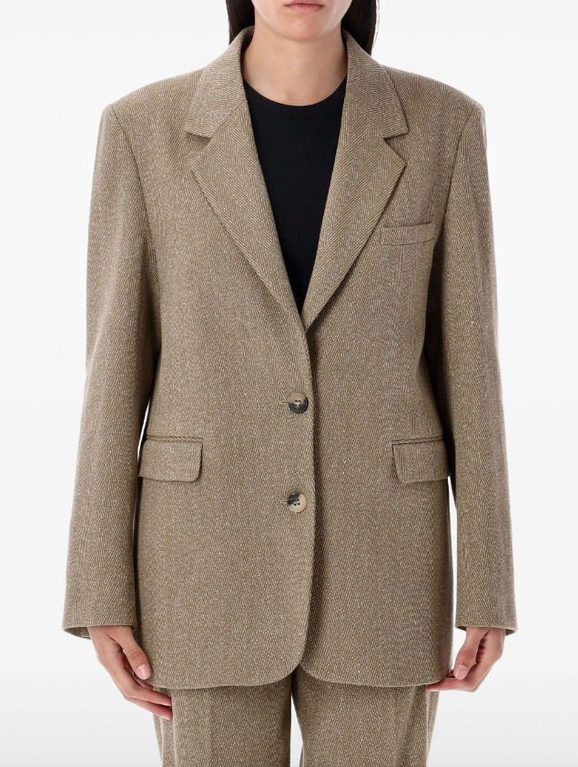 Brown blazer worn by a person on a white background