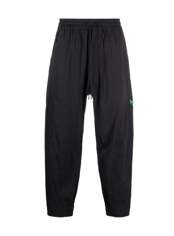 Black pants with a brand logo on a white background