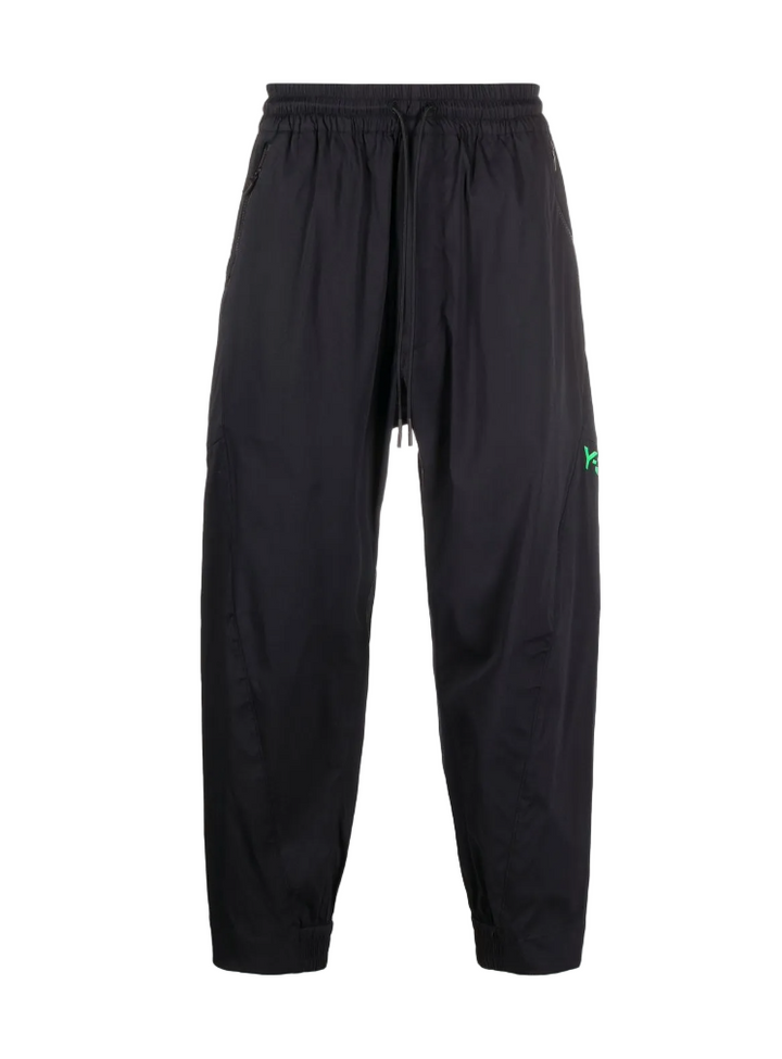 Black pants with a brand logo on a white background