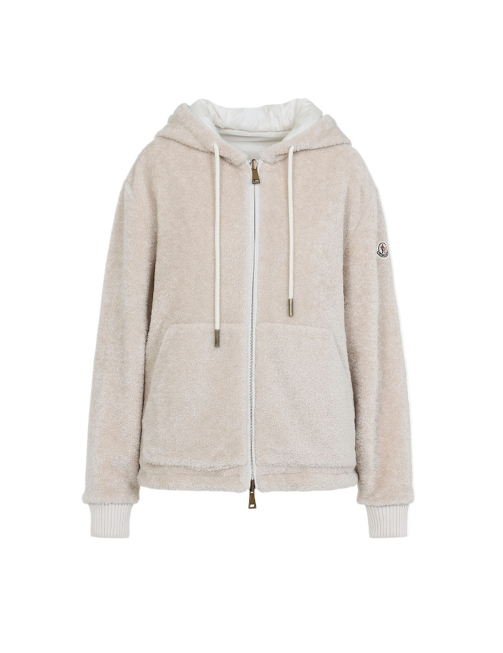 Beige hoodie with a brand logo on a white background