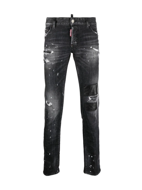 Black distressed jeans on a white background