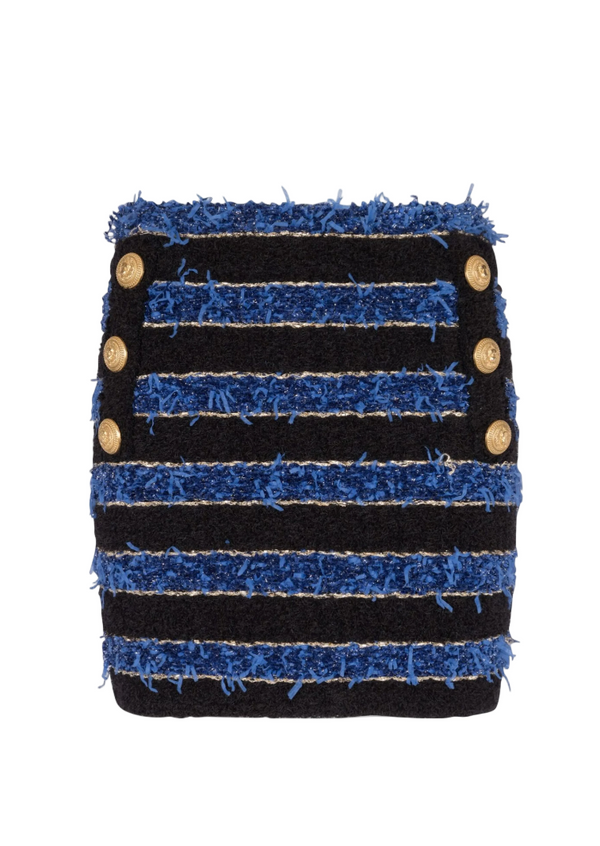Textured black and blue pouch with button details on a computer screen.