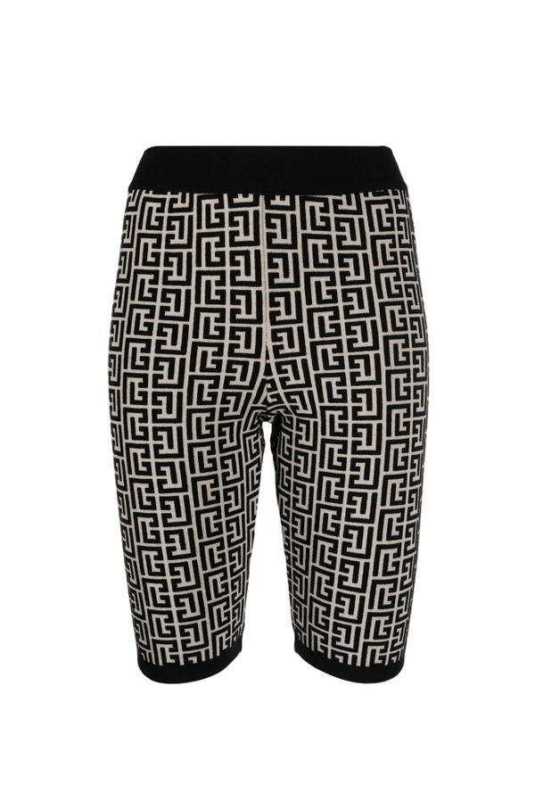 Black shorts with white geometric pattern on a computer screen background